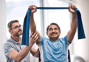Rehabilitation therapist working with a patient