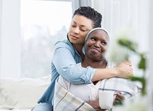 A woman hugging her mother
