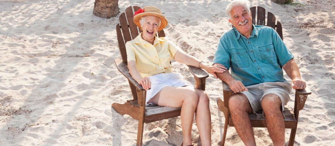 Elderly couple sitting outside